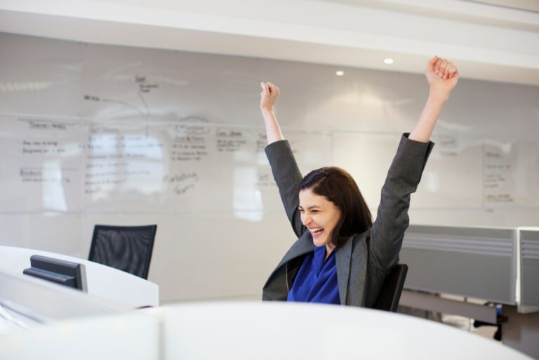 Businesswoman Celebrating Work Table