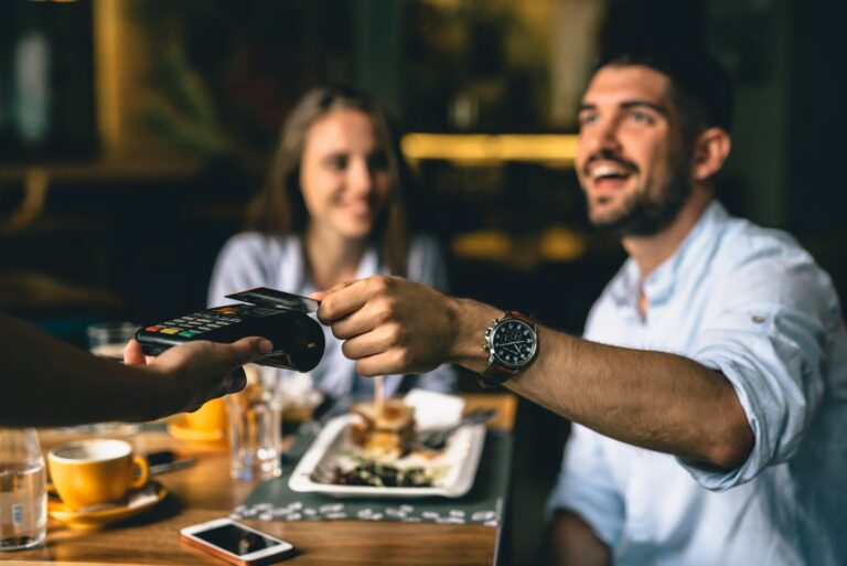 Man Paying Restaurant Meal With Credit Card