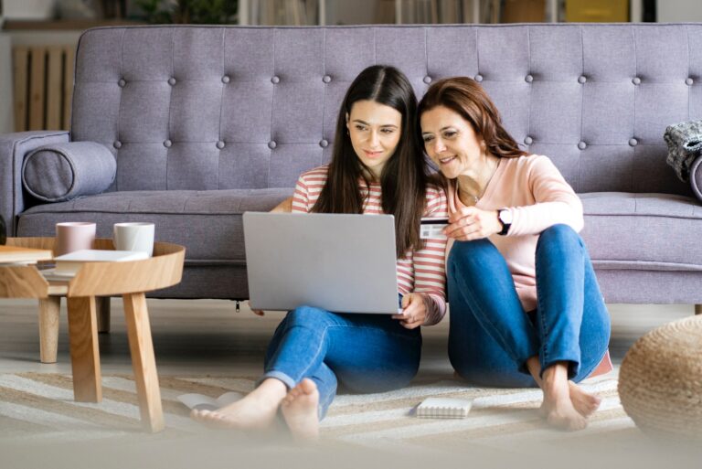 Mom Helping Daughter With Credit Card