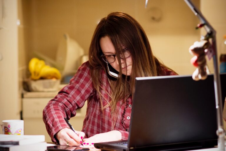 Woman Balancing Checkbook