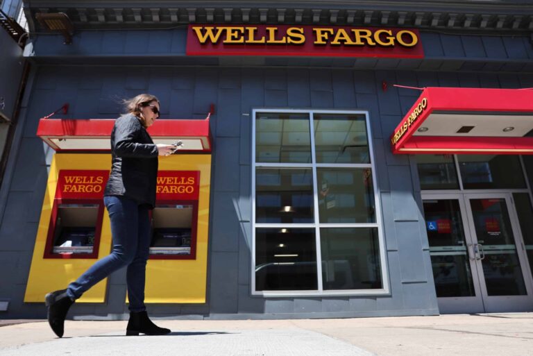 Woman Walking By Wells Fargo